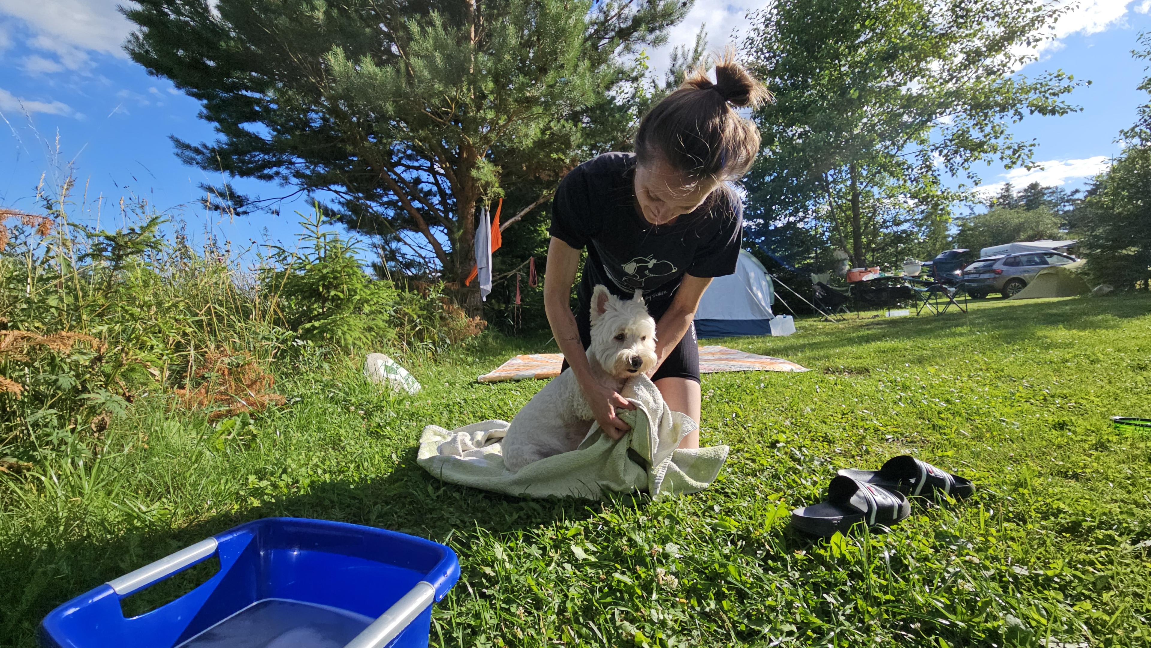 Washing Leeloo's paws after a day of hiking in the mud